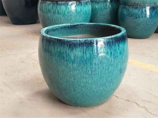 Vaso all'aperto ceramico blu lustrato rotondo della pianta verde del fiore